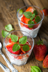 Healthy dessert, coconut milk with chia seeds and fresh strawberries