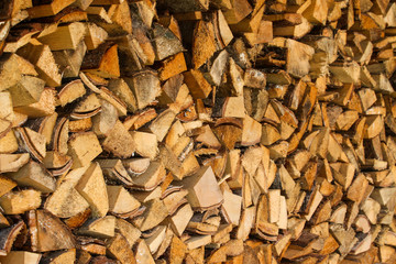 Beautiful view of stacked wood in a beautiful sunny day, countryside.