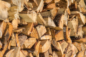 Beautiful view of stacked wood in a beautiful sunny day, countryside.