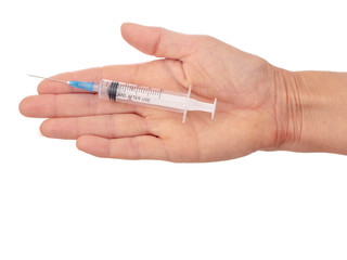 Fototapeta premium Woman's flat hand with plastic disposable, mono use syringe. Isolated on white background.