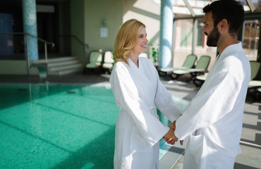 Portrait of attractive couple in spa center