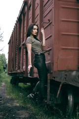 Plakat Powerful Woman Holding Gun Action Movie Style. Train adventure. Military girl with glock.