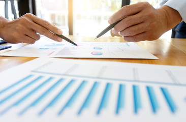 business businessman in meeting analyses chart graphy
