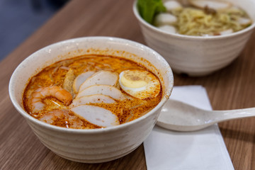 Laksa is a spicy noodle soup popular in Peranakan cuisine of Southeast Asia