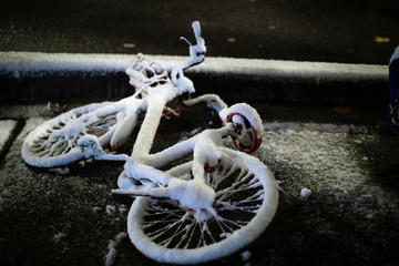bicycle in dark snow night