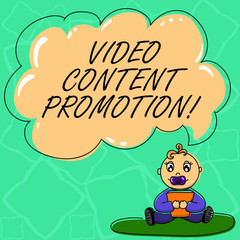 Word writing text Video Content Promotion. Business concept for video with the intent to promote the products Baby Sitting on Rug with Pacifier Book and Blank Color Cloud Speech Bubble