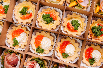 Collection of take away kraft boxes with  different food. Set of containers with everyday meals - meat, vegetables and law fat snacks on white background, top view. 