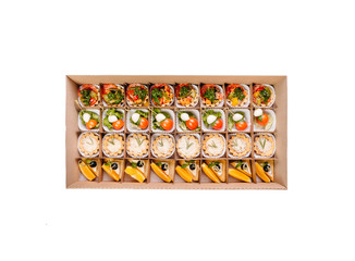Collection of take away kraft boxes with  different food. Set of containers with everyday meals - meat, vegetables and law fat snacks on white background, top view. 