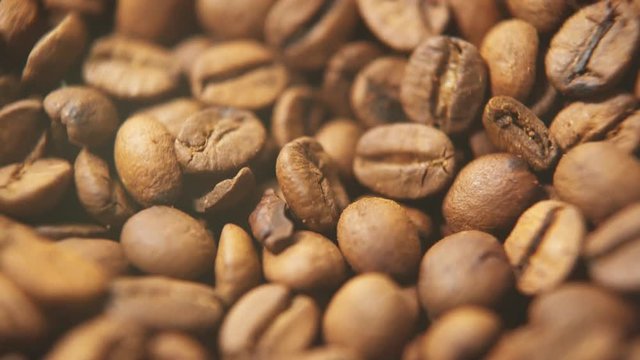 Slow Motion Shot Of Coffee Beans Rotating, Closeup.