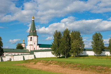 Fototapeta na wymiar Valdai Iversky Svyatoozersky Virgin Monastery for Men. Selvitsky Island, Valdai Lake. Bell tower and Iver Cathedral