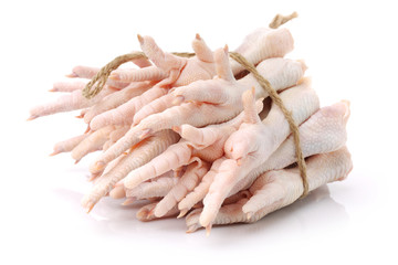 Fototapeta na wymiar Chicken feet on white background