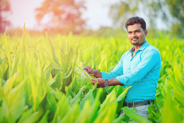 young indian farmer at field