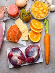 Foods rich in natural vitamin D as fish, eggs, cheese, shrimps, caviar, corn flakes, kiwi, turkey, mushrooms, orange, carrot, hearts