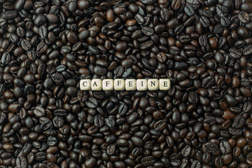 The coffee roasted and text wood cube close up image.