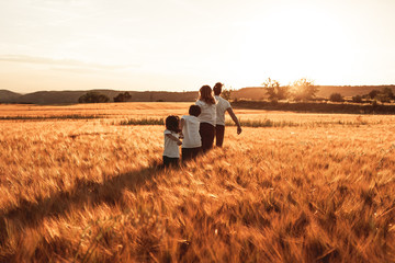 Happy and fun family in nature. Concept of united family having fun and smiling