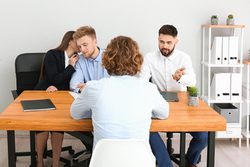 Human resources commission interviewing man in office
