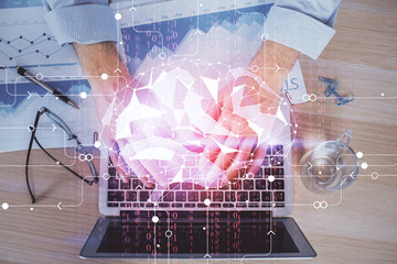 Man typing on keyboard background with brain hologram. Concept of big Data.