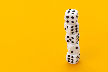 dice on a yellow background