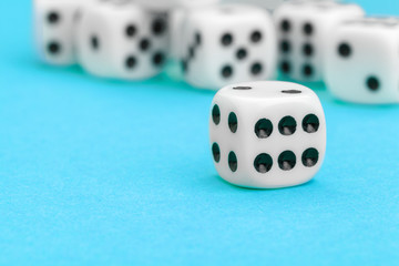 Gaming dices on blue background. Game concept.