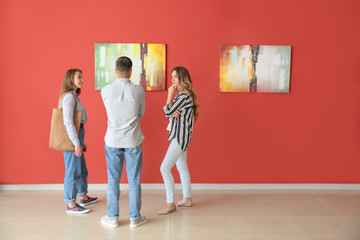 People at exhibition in modern art gallery