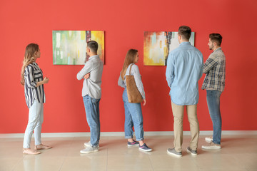 People at exhibition in modern art gallery