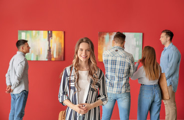 People at exhibition in modern art gallery