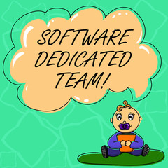 Word writing text Software Dedicated Team. Business concept for business approach to app and web development Baby Sitting on Rug with Pacifier Book and Blank Color Cloud Speech Bubble