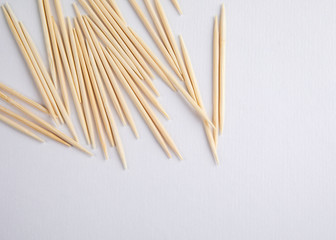 Bamboo wooden toothpicks on white background