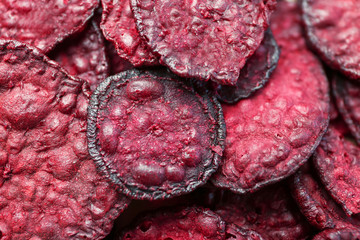 Tasty beet chips as background