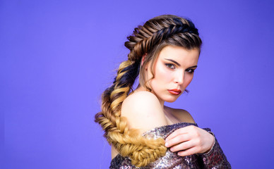Girl makeup face braided long hair. French braid. Professional hair care and creating hairstyle. Braided hairstyle. Beautiful young woman with modern hairstyle. Beauty salon hairdresser art