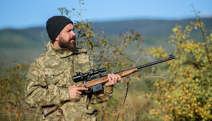Hunting equipment for professionals. Hunting is brutal masculine hobby. Man aiming target nature...