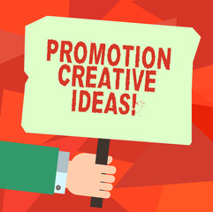 Conceptual hand writing showing Promotion Creative Ideas. Business photo text draws attention to your organization or initiative Hu analysis Hand Holding Colored Placard with Stick Text Space