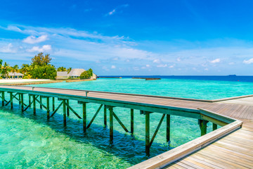 Obraz premium Beautiful water villas in tropical Maldives island .