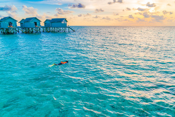 Snorkeling in tropical Maldives island .