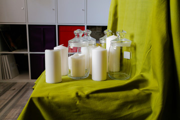 The candles, glassware and green drapery.