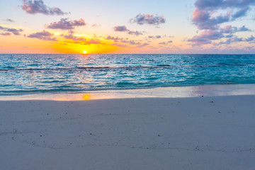 Fototapeta na wymiar Beautiful sunset with sky over calm sea in tropical Maldives island