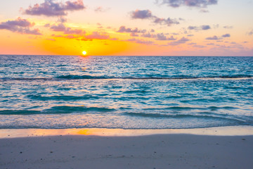 Naklejka na ściany i meble Beautiful sunset with sky over calm sea in tropical Maldives island