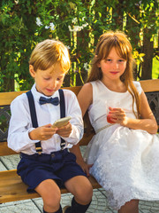 Elegant children relaxing at a wedding