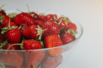 Strawberries in a transparent bowl