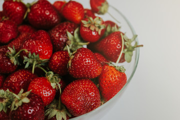 Strawberries in a transparent bowl