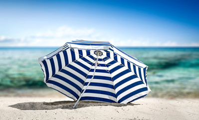 Summer umbrella on beach and free space for your decoration. 