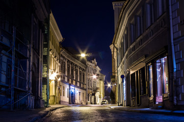 Fototapeta na wymiar Narrow street in the Old Town of Vilnius at night. Lithuania