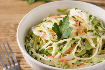 Coleslaw salad in white bowl