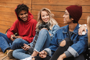 Group if cheerful multiethnic friends teenagers