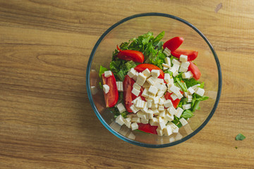 Top view healthy greek salad with vegetables