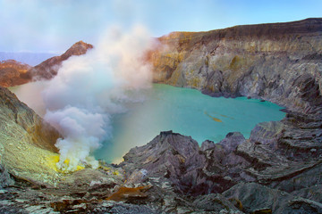 SMOKE OF SULFUR ON KAWAH IJEN VOLCANO IN JAVA ISLAND-INDONESIA