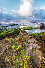 view of the sea with rocks in the foreground