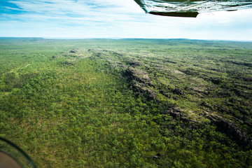 Light aircraft flying towards river valley Kakadu National Park Northern Territory Australia © Marlon's world