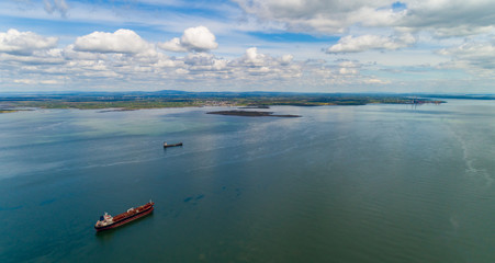 Aerial view of Cargo ships entering the river Shannon in the republic of Ireland