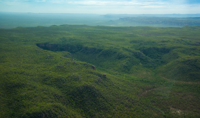 Light aircraft flying over rough terrain Kakadu National Park Northern Territory Australia © Marlon's world